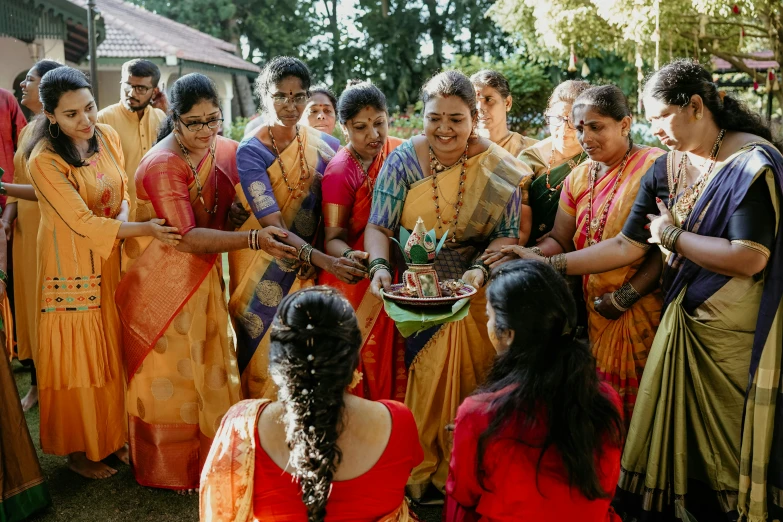 a group of women getting ready to perform an indian ceremony