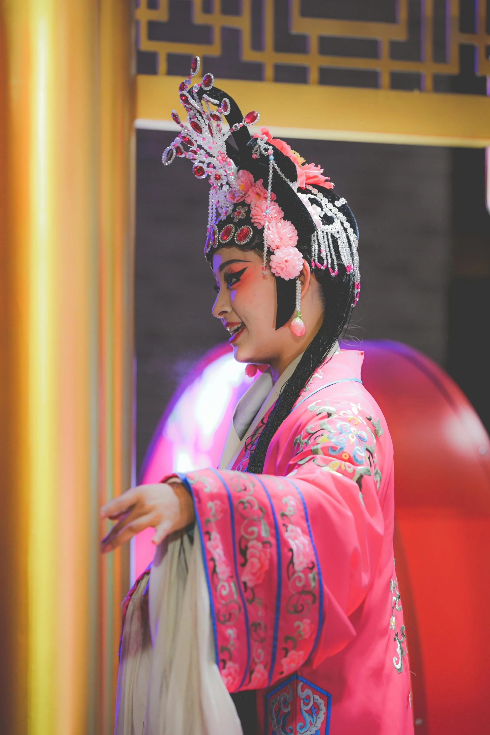 a woman in asian style clothes using her cell phone