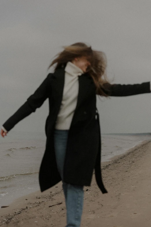 a person that is running along a beach