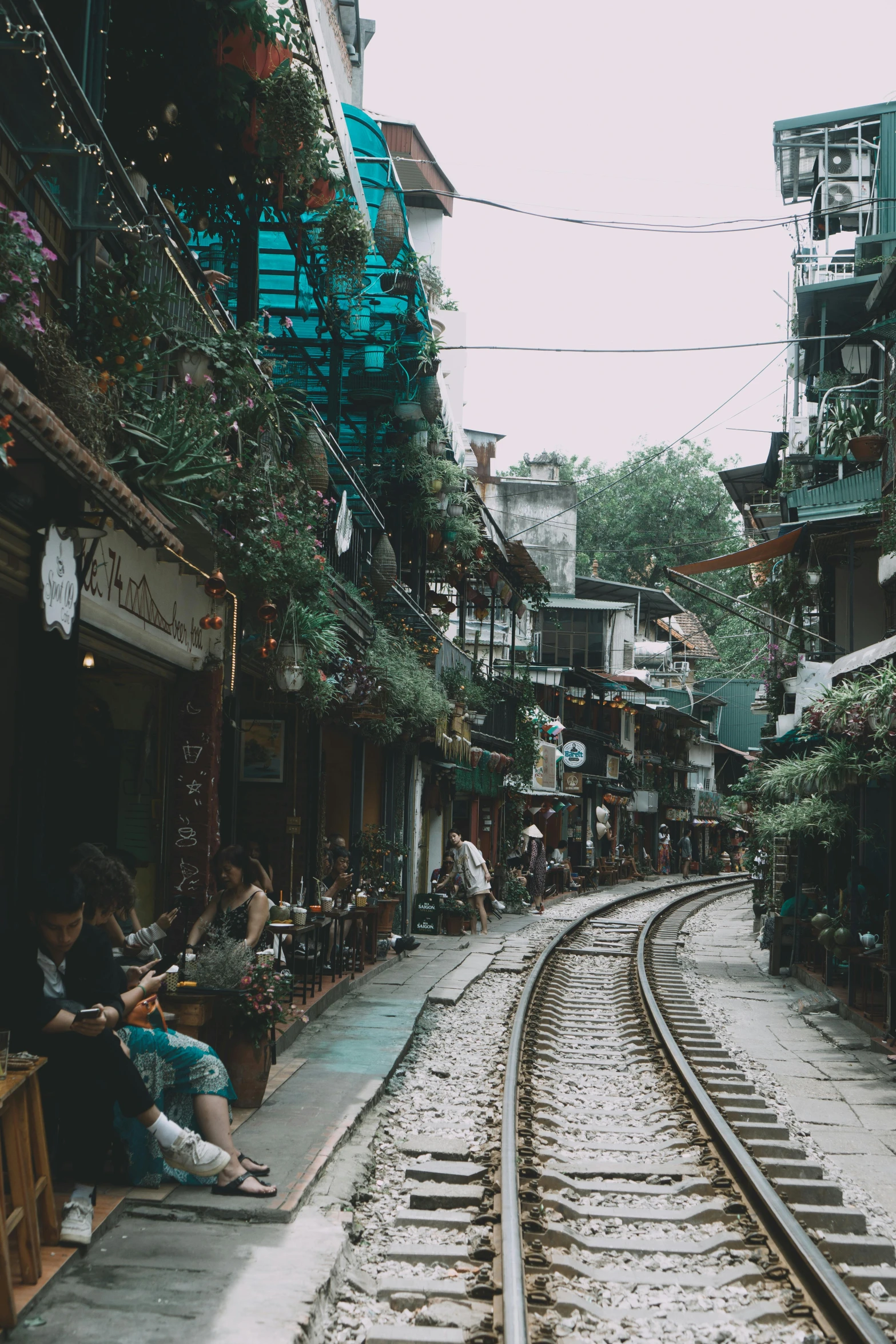 a train track runs through an asian town