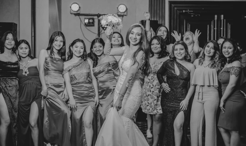 the bride and her bridesmaids posing for the camera