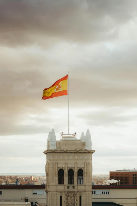 a flag flying at the top of a building