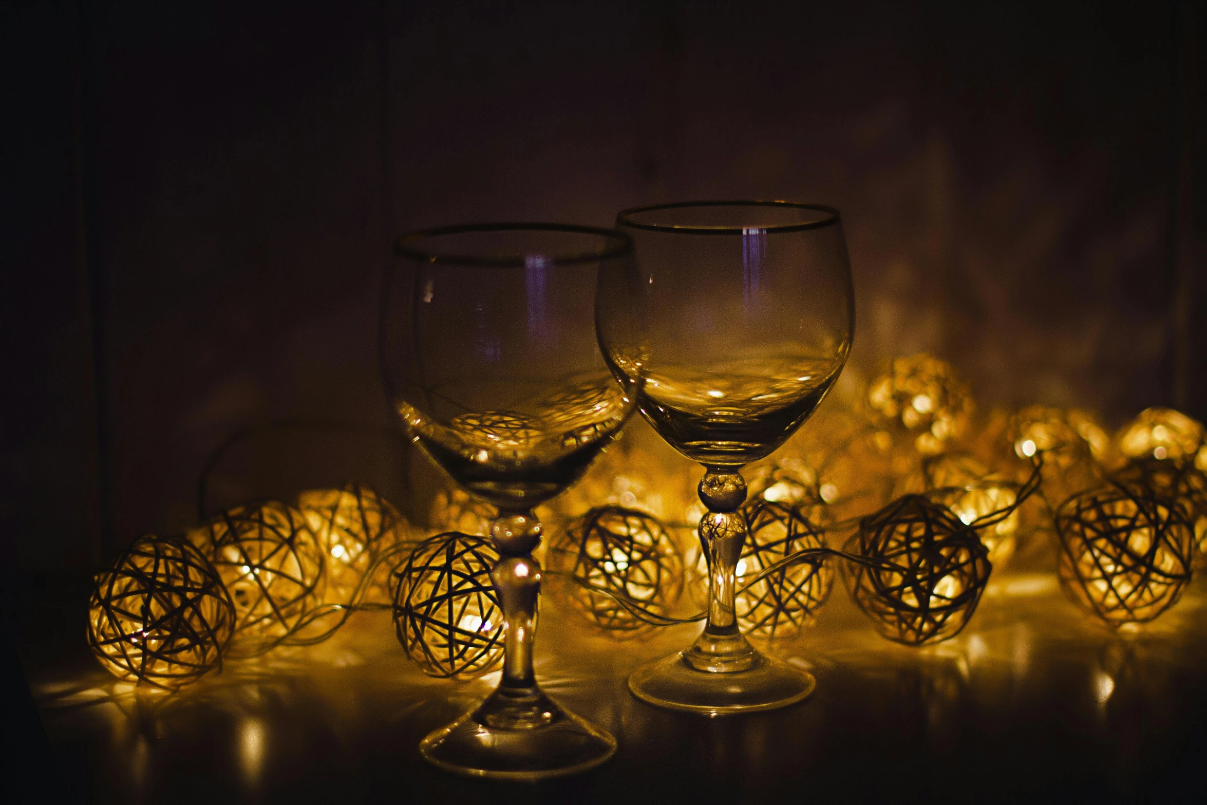 two wine glasses in a group with one with a stem