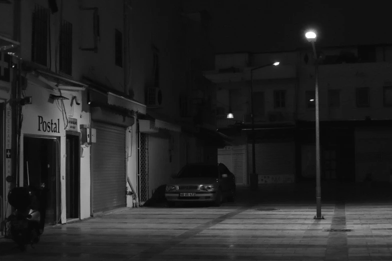 a car parked outside a building at night