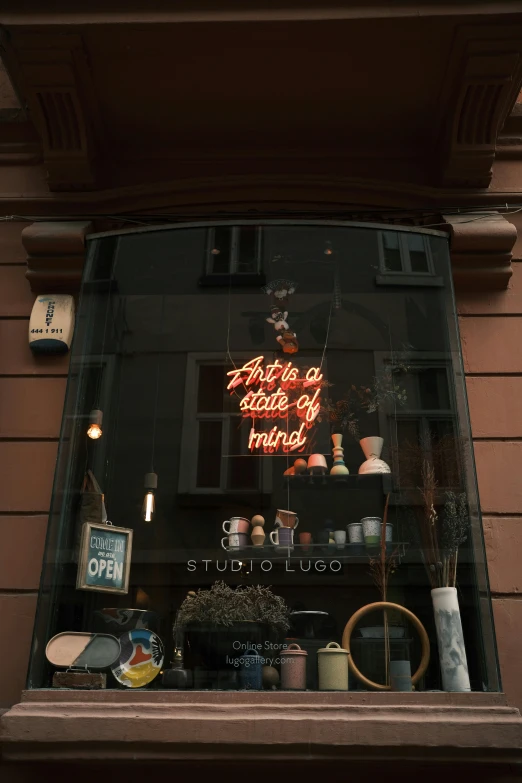 a store front window that has an assortment of items in it