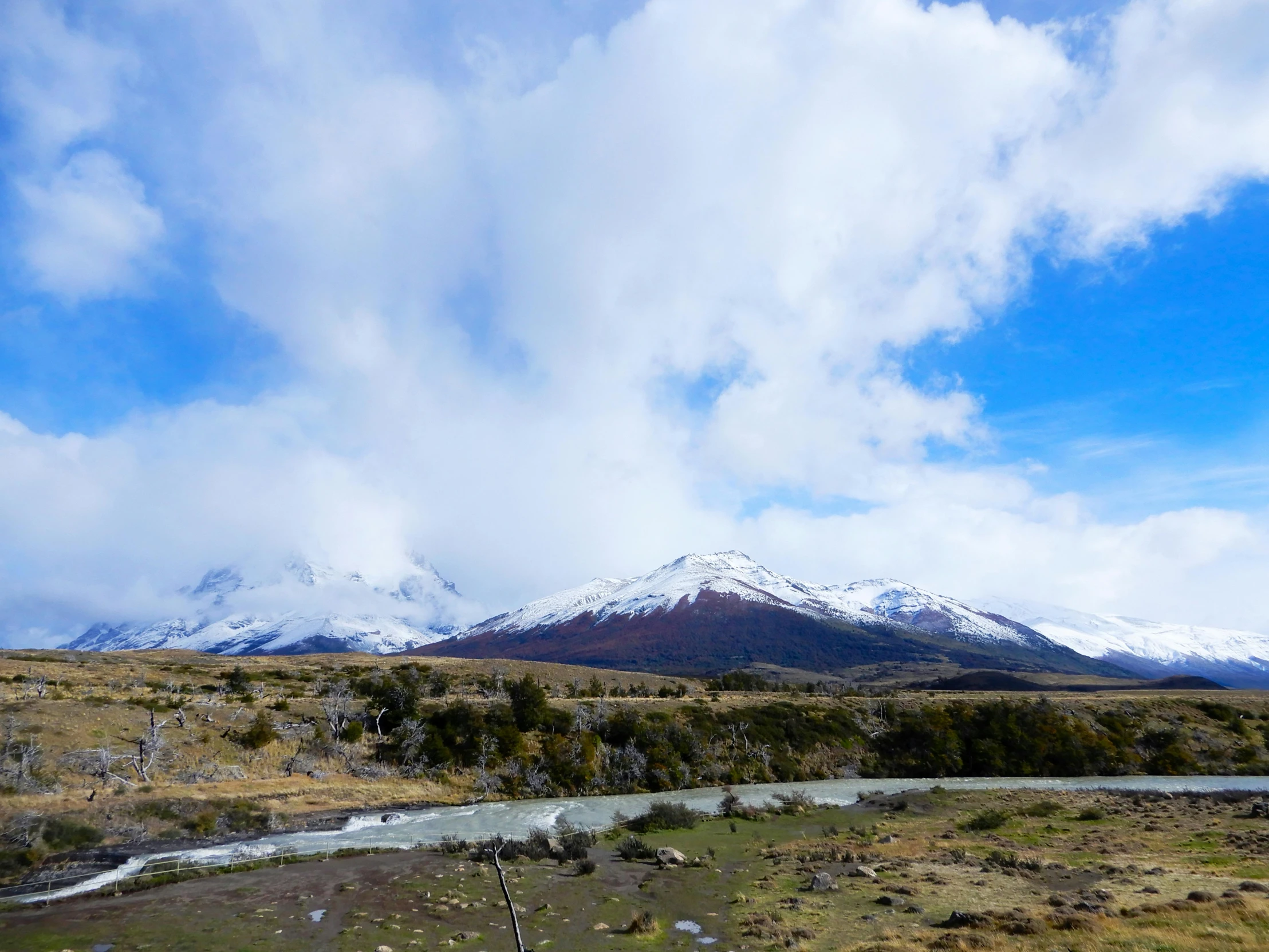 a view of a mountain range and a river