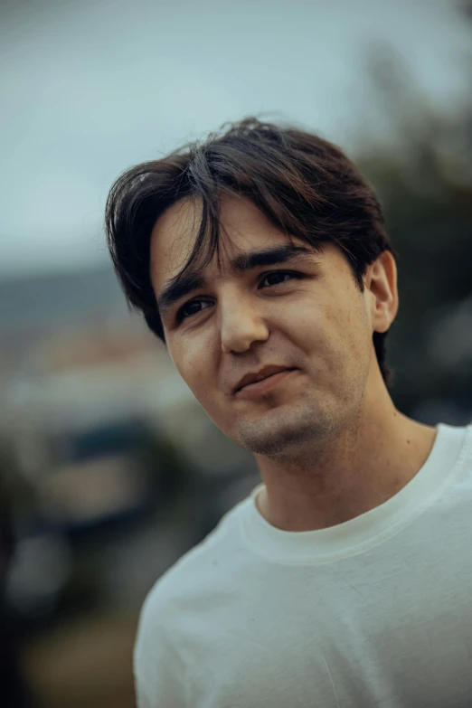 a man is standing outdoors looking forward