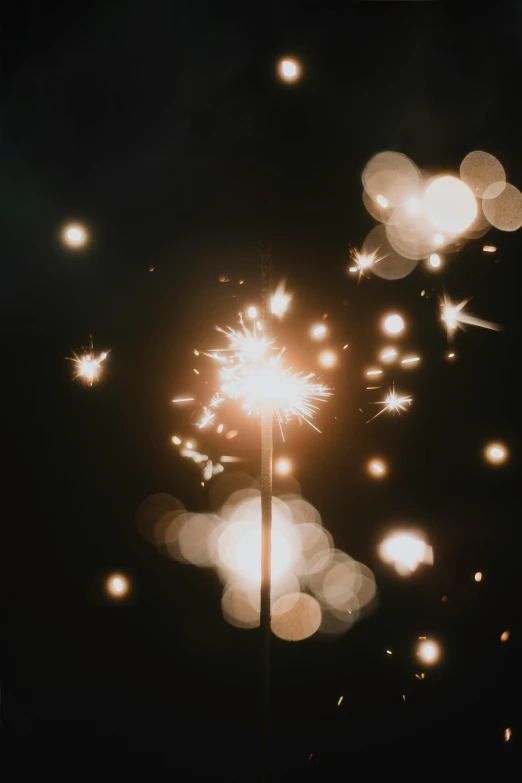 fireworks on a pole at night on the ground