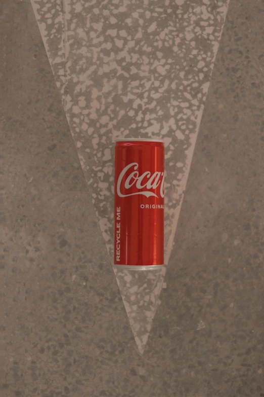 a can is attached to a wall on the floor