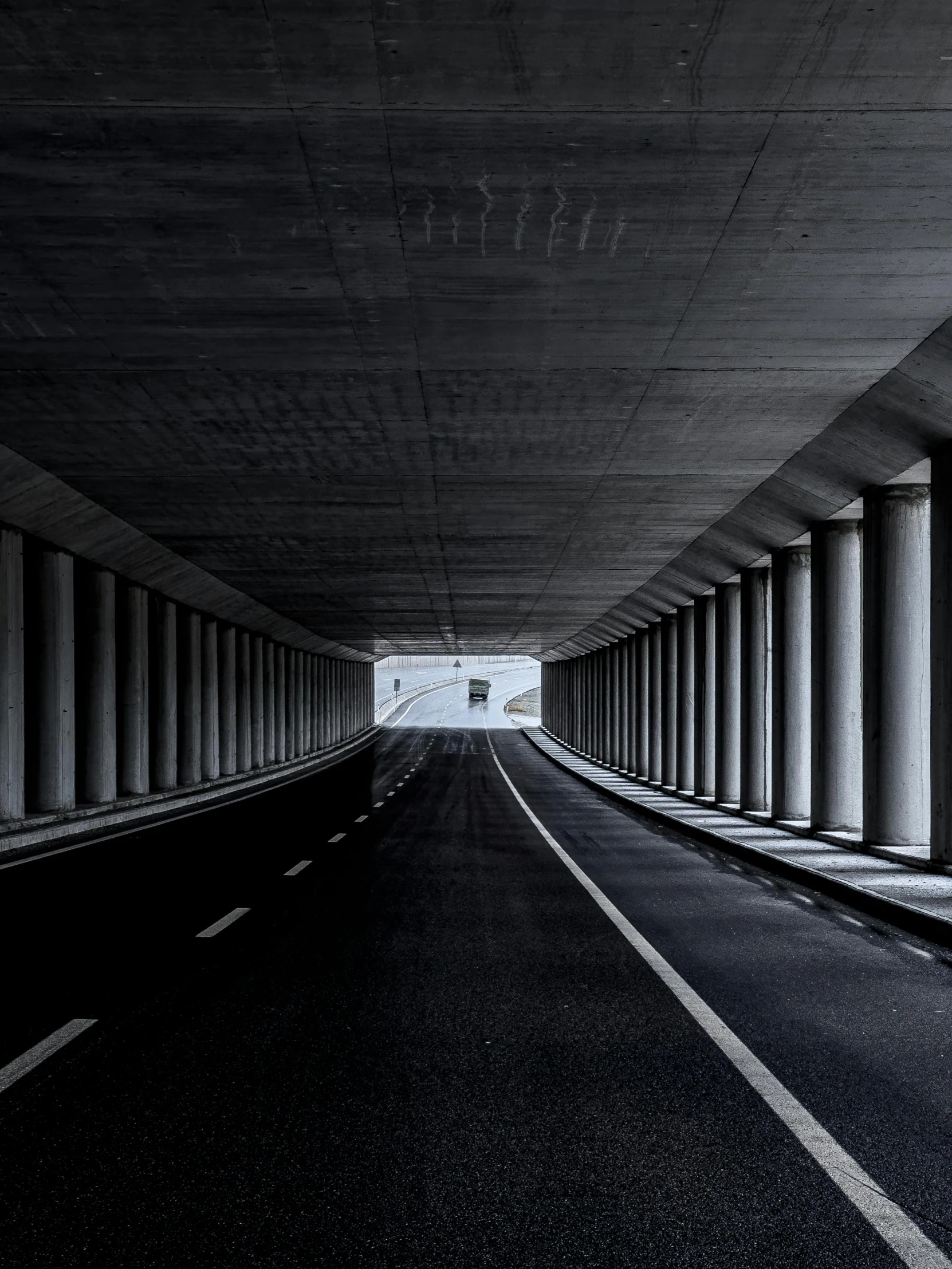 a street with some pillars and black and white po