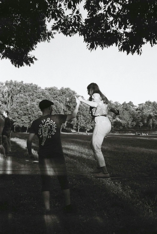 black and white pograph of some children on the grass