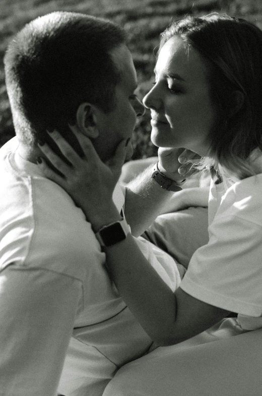 black and white po of couple lying on their bed