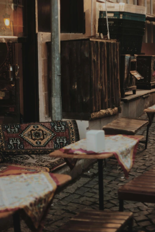 a couple tables are set out on the street