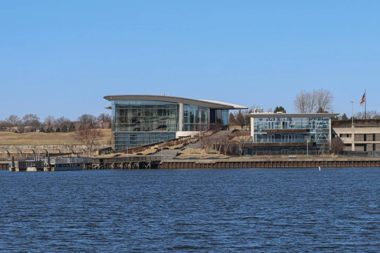 view of a building over looking the water in the winter