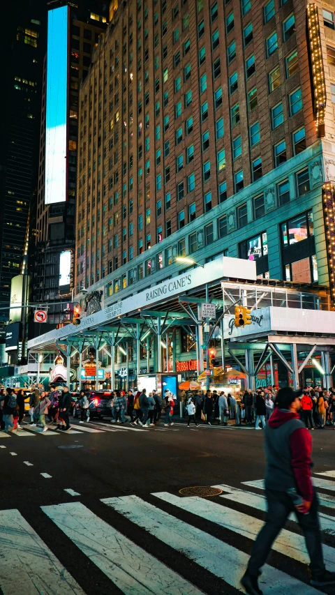 a busy city street with lots of people and lots of buildings