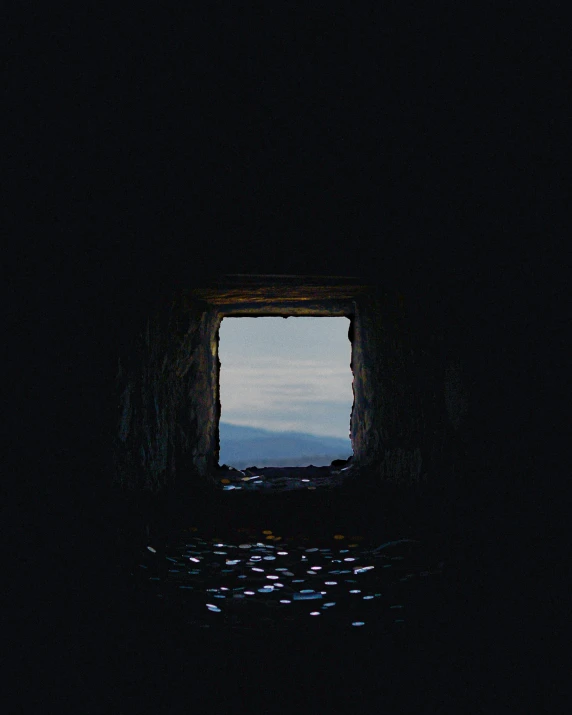 a window lit up at night with the sky outside