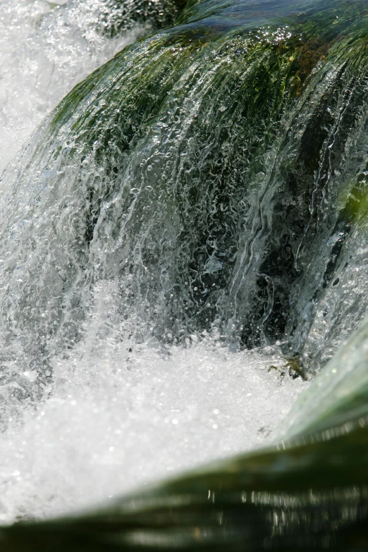 a close up of the water in a waterfall