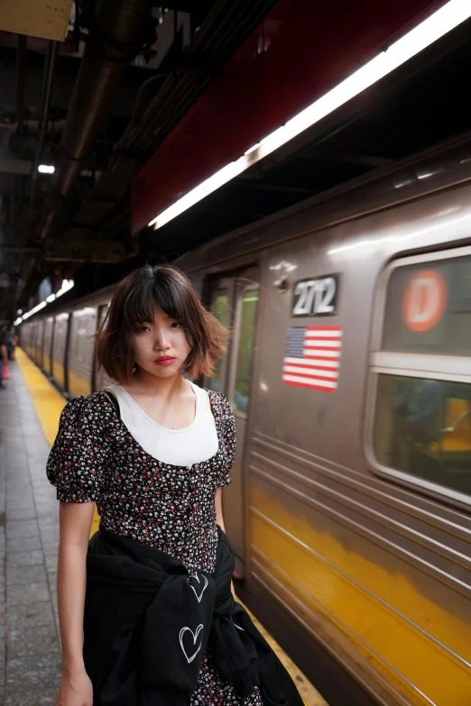  on a train platform waiting for the next train