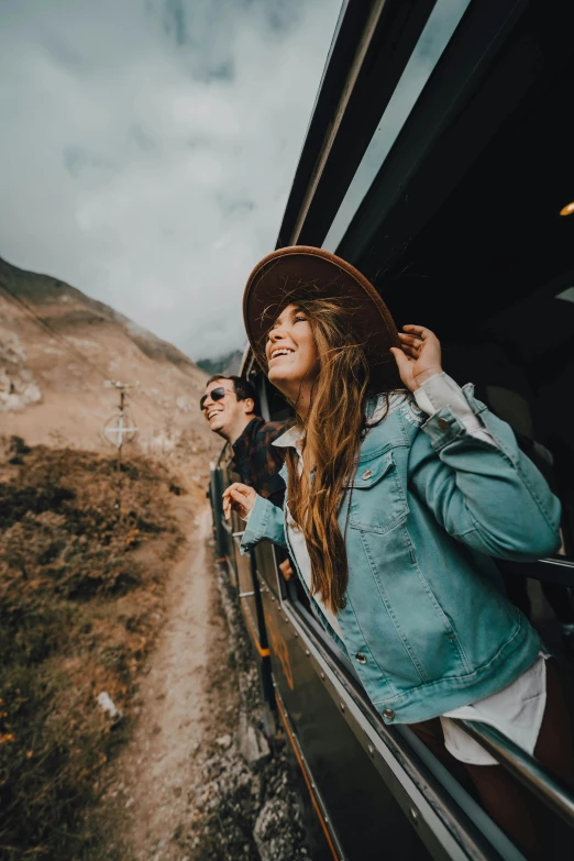 people traveling by vehicle looking out the window