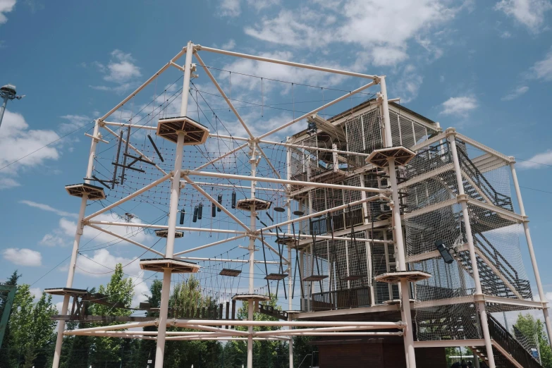 a wooden structure with multiple steps that goes up into the sky