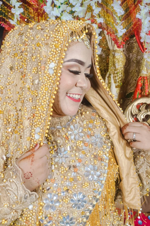 the  smiles as she holds a wooden item