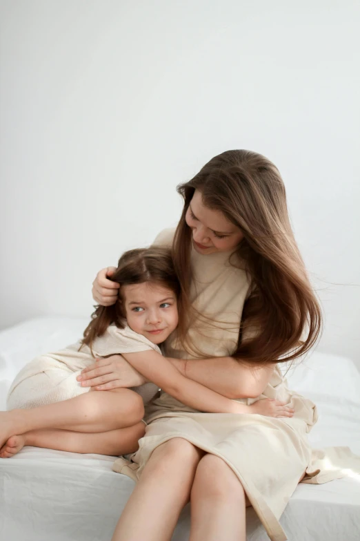 a  and her mother wrapped up in blankets