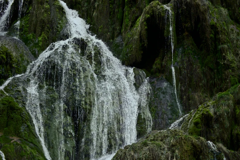 there are water gushers in this small waterfall