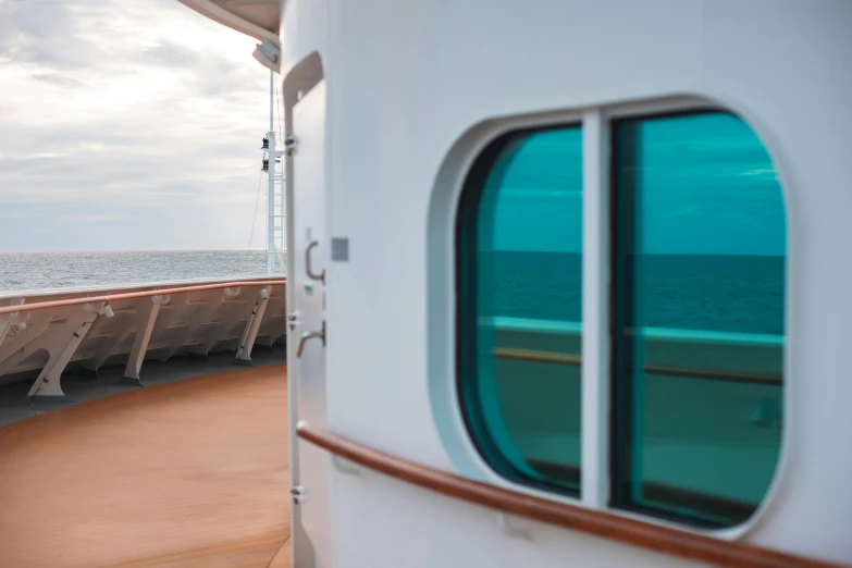 a deck that has tables on it by the ocean