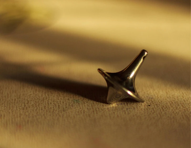 a metal object sitting on top of a carpeted floor