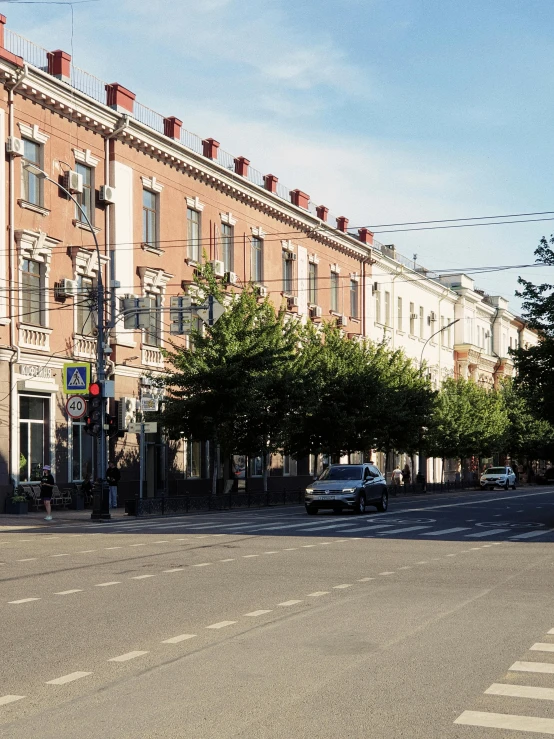 a row of brownstone houses with parking spaces