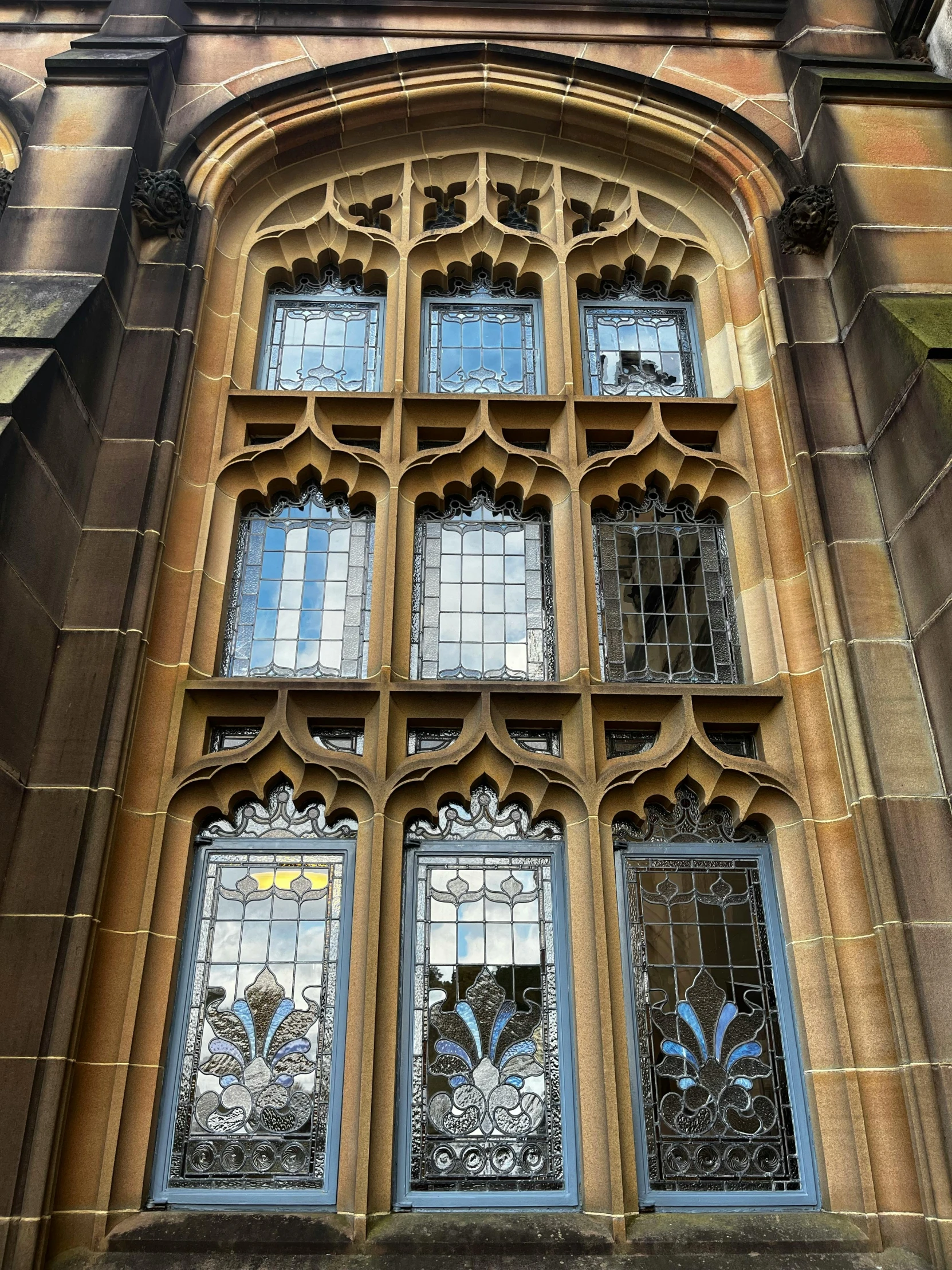 an old, stone building has stained glass window