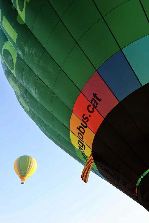 the bottom of many colorful  air balloons