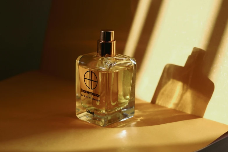 a bottle of perfume sitting on top of a wooden table