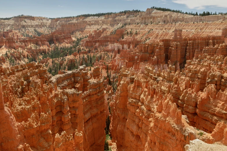 an overhead view of canyons at the top of a mountain