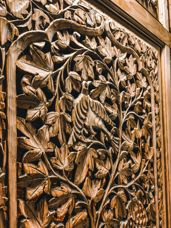 ornate wooden carving on the side of a building