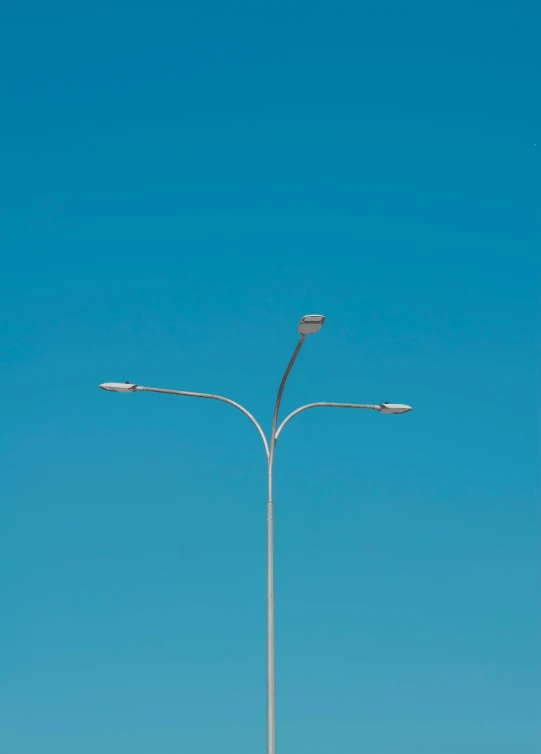 two street lamps on a pole that is not installed