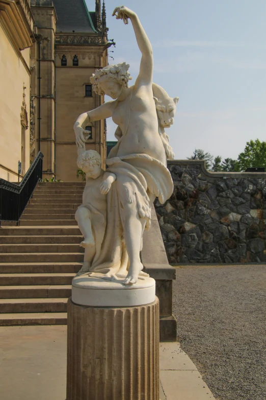 statue outside with outdoor stairway and stairway