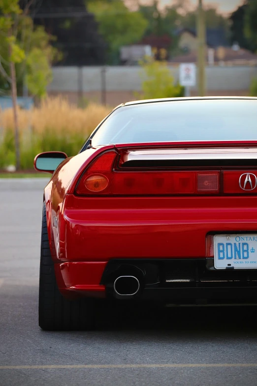 this is a red honda sci coupe parked