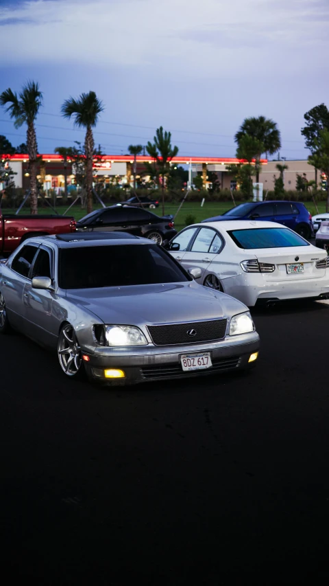 a line of cars parked next to each other