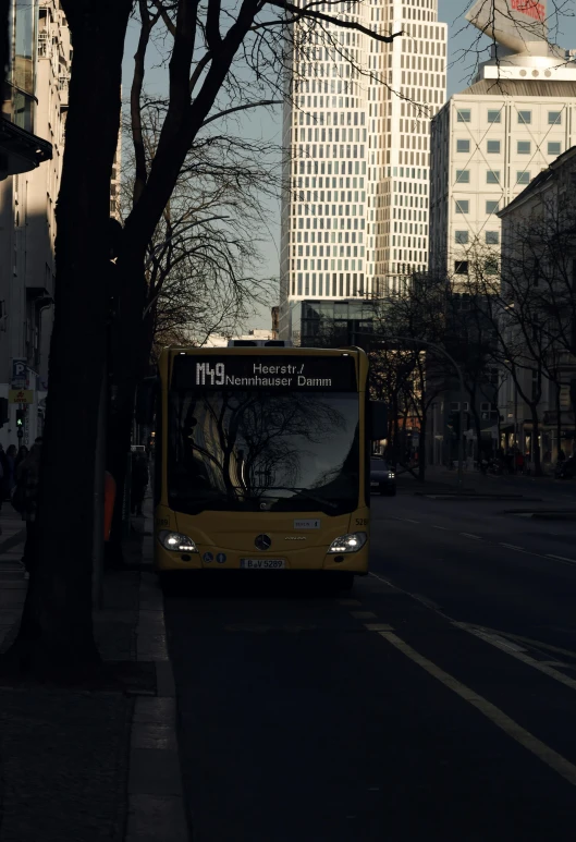 the bus is parked on the side of the street