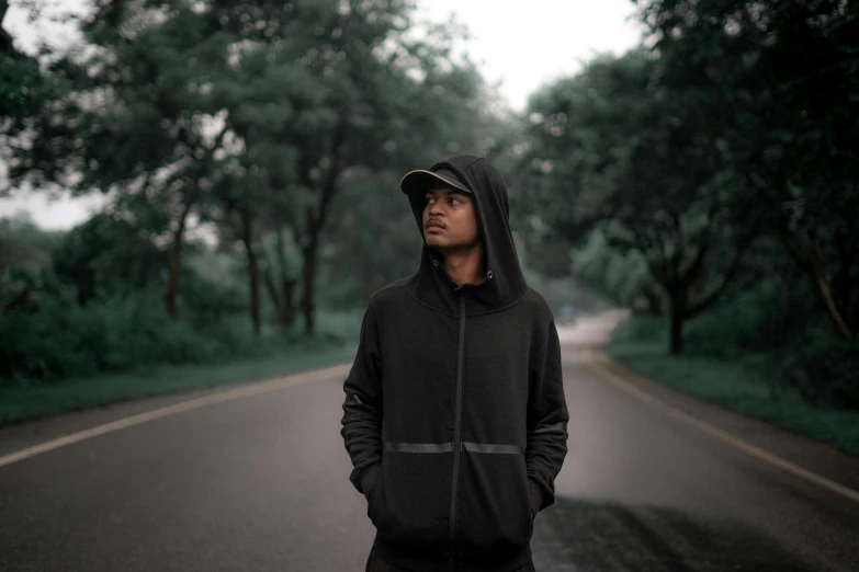 a man standing in the middle of the road