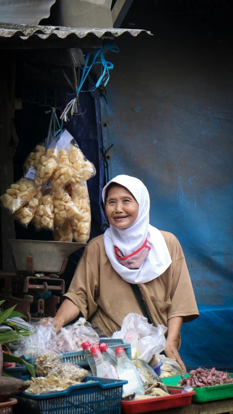 woman standing near baskets filled with bread on display