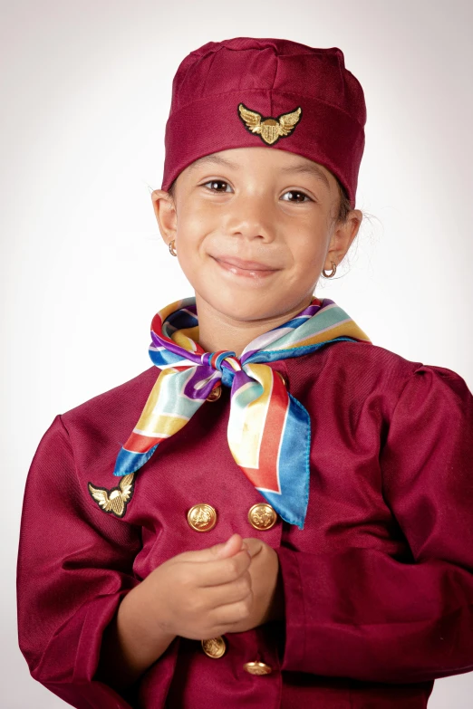 a small child is dressed up and smiling