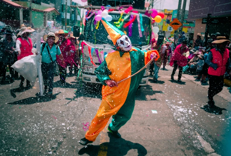 people are standing in the street near a truck