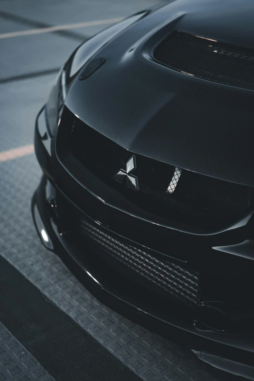 the front end of a black sports car