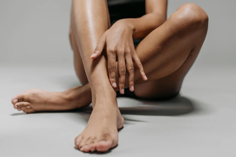 a women legs with no shoes on with white background