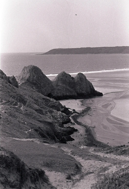 there is a black and white po of the beach