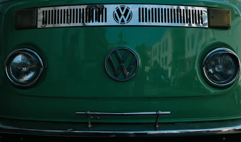 the headlight and emblems of a vw bus