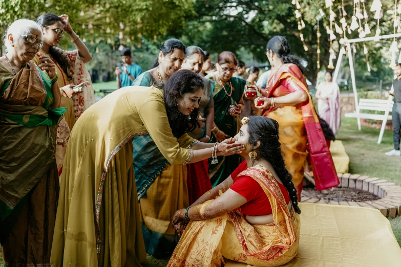 woman having her makeup done by the bride