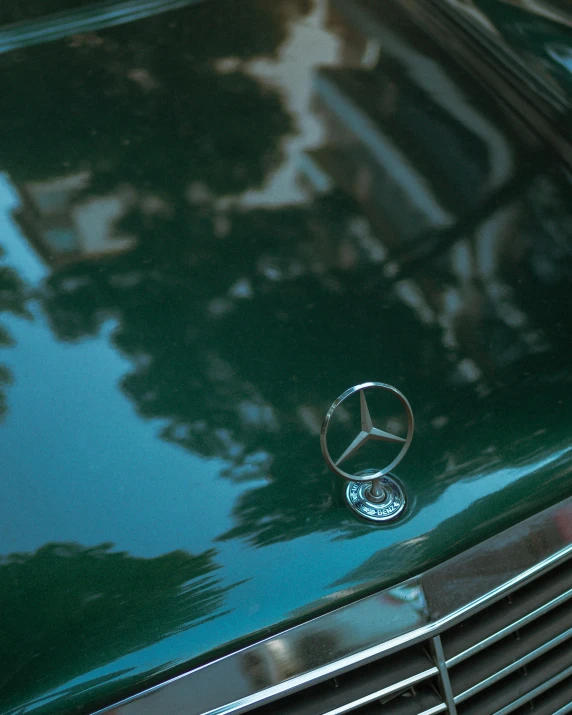 a mercedes sports car emblem in close up